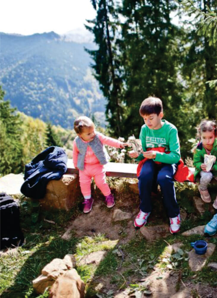 three kids resting in mountains travel in Great Rift Valley, Kenya on 10-Day Kenya & Tanzania safari with kids