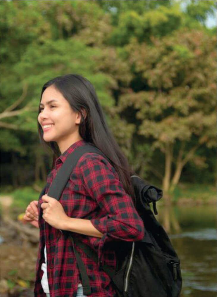 young woman is enjoying with nature on shores of Lake Nakuru on affordable Masai Mara Lake Nakuru safari tour