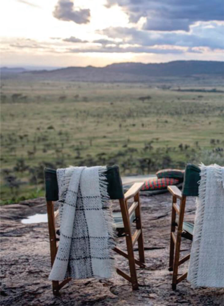 chairs are set up, in a stunningly scenic site and sunset in Masai Mara on luxury Mara Serena Safari Lodge Masai Mara group tour